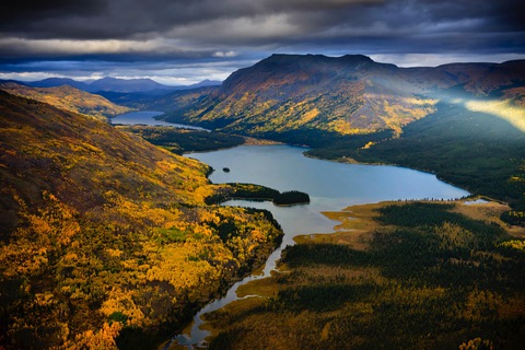 Autumn high country of the Klappan, lakes threading between golden slopes